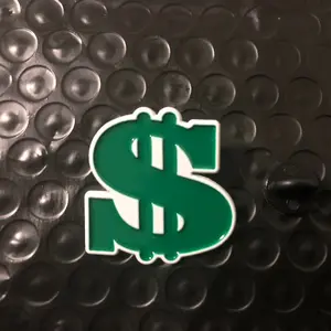 Dollar Sign Enamel Pin - Green and White Icon on Black Background