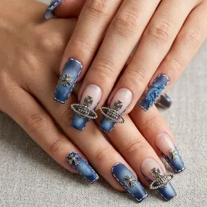 Elegant Blue Gradient Nails with Gold Star and Planet Accents for a Unique Manicure Look