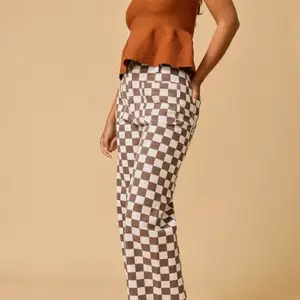 Brown and white checkered jeans Womenswear
