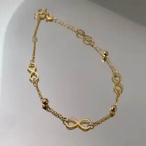 14k Gold Infinity Bracelet with Delicate Chain and Beaded Accents Size 7 Inches for Women Elegant and Versatile Accessory