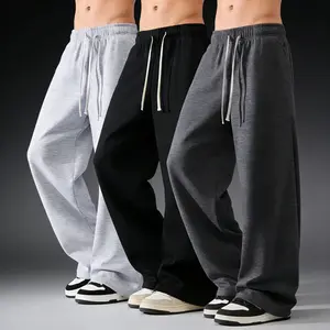 Men's 100% polyester loose-fitting sweatpants, drawstring elastic waistband, wide cut, casual everyday wear, spring style