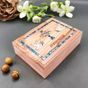 Beautiful olive wood box with mother of pearl cross and doves, engraved with "Jerusalem." Perfect for keepsakes or special gifts!