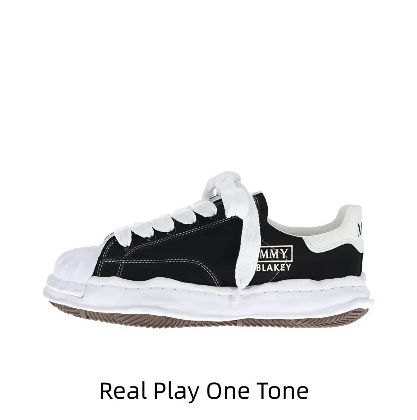 Sleek black shell toe casual sneakers with wavy layered thick white sole, clean square white side print and oversized fluffy wide laces, matching all street fits to create cool minimalist vintage daily styling