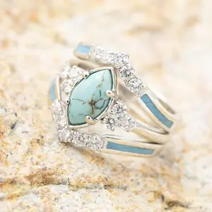 Women's silver-plated ring with a hollow turquoise stone and delicate rhinestone embellishments, suitable as an engagement ring, wedding ring, anniversary ring, or birthday gift.