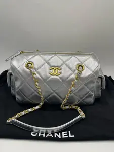 Pre-owned CHANEL Bowling Bag, 25K, 99% New (some protective film still intact). Pearl silver color, made of calfskin leather.