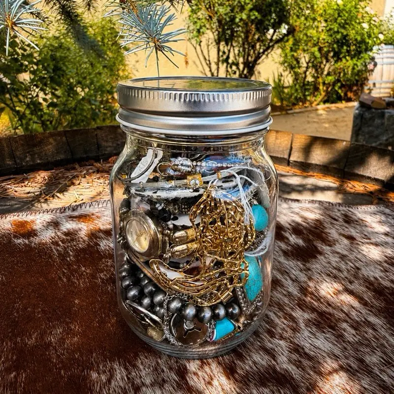 Mason jar filled with mystery western jewelry