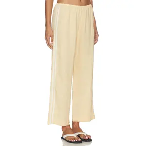 DONNI. The Linen Crop Racer Stripe Pant in Butter
