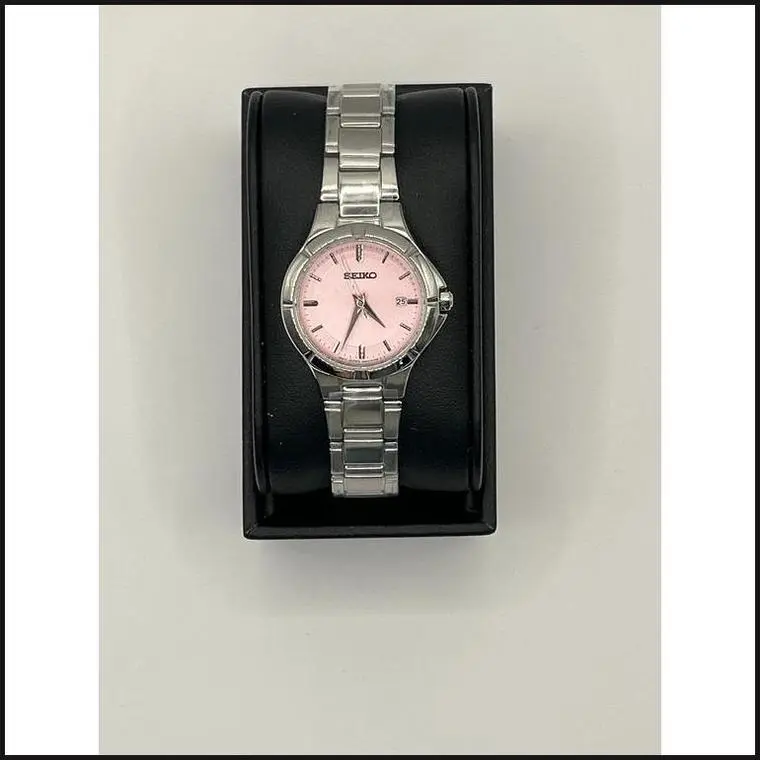 Ladies silver tone with pink dial watch