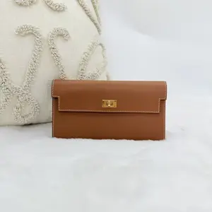 Pre-owned HERMÈS Hermes Kelly Pocket Long wallet in gold tone hardware and brown leather WWL