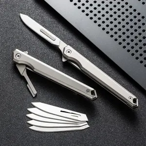 Men’s tactical EDC folding knife with interchangeable blades—utility/pocket knife, fruit knife—includes 5 blades and a back clip for easy carry; suitable for outdoor survival, emergencies, camping, hiking, DIY, and fishing.