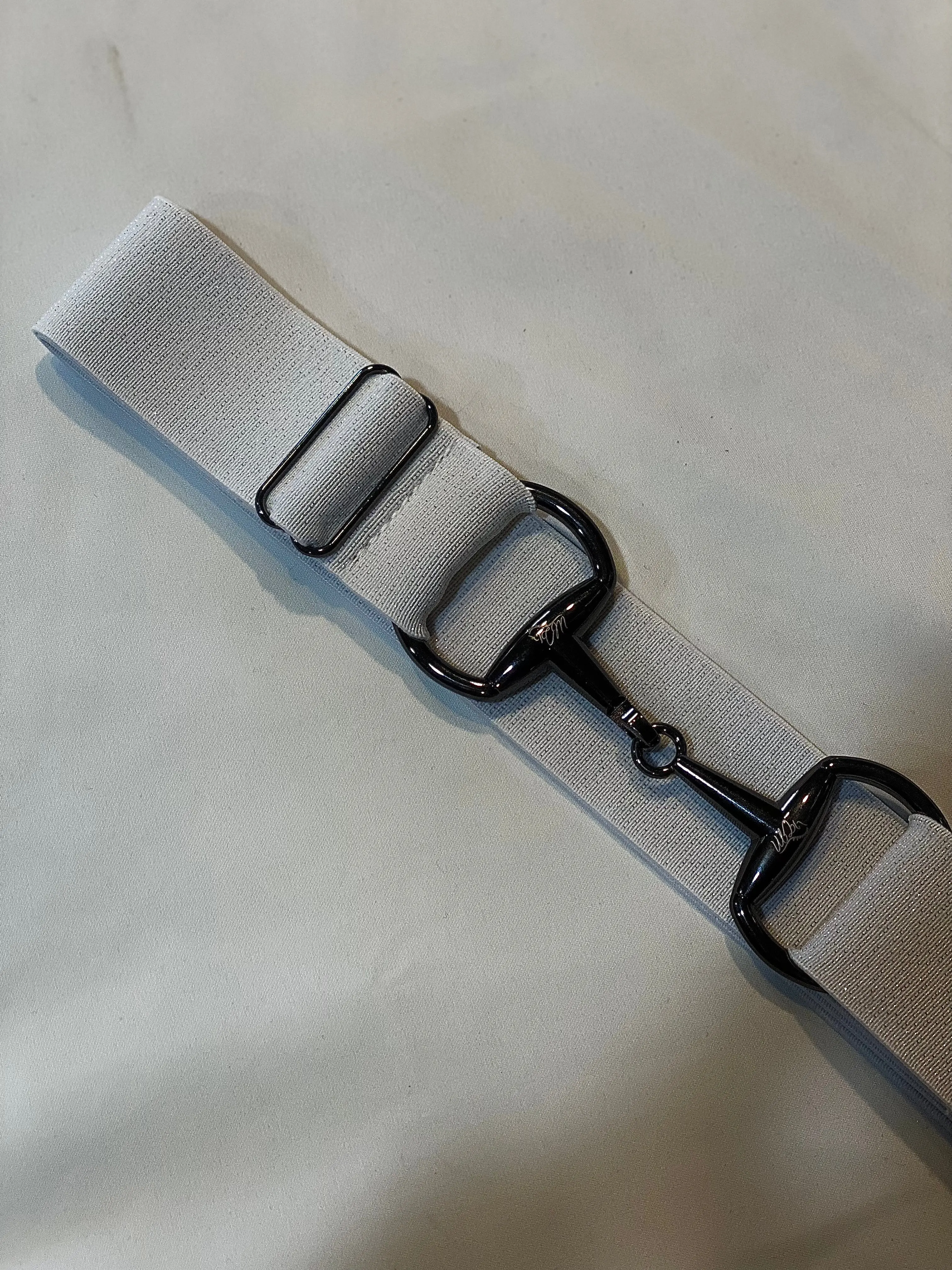 White sparkle with gun metal buckle