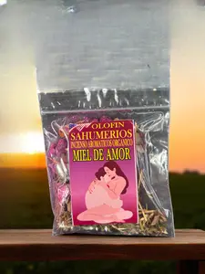 Olofin Sahumerios Miel de Amor Incense  Product Image Shows Packaging with Sunset Background