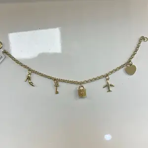 Women's Charm Bracelet with Shoe, Key, Padlock, and Airplane Charms for Stylish Accessory