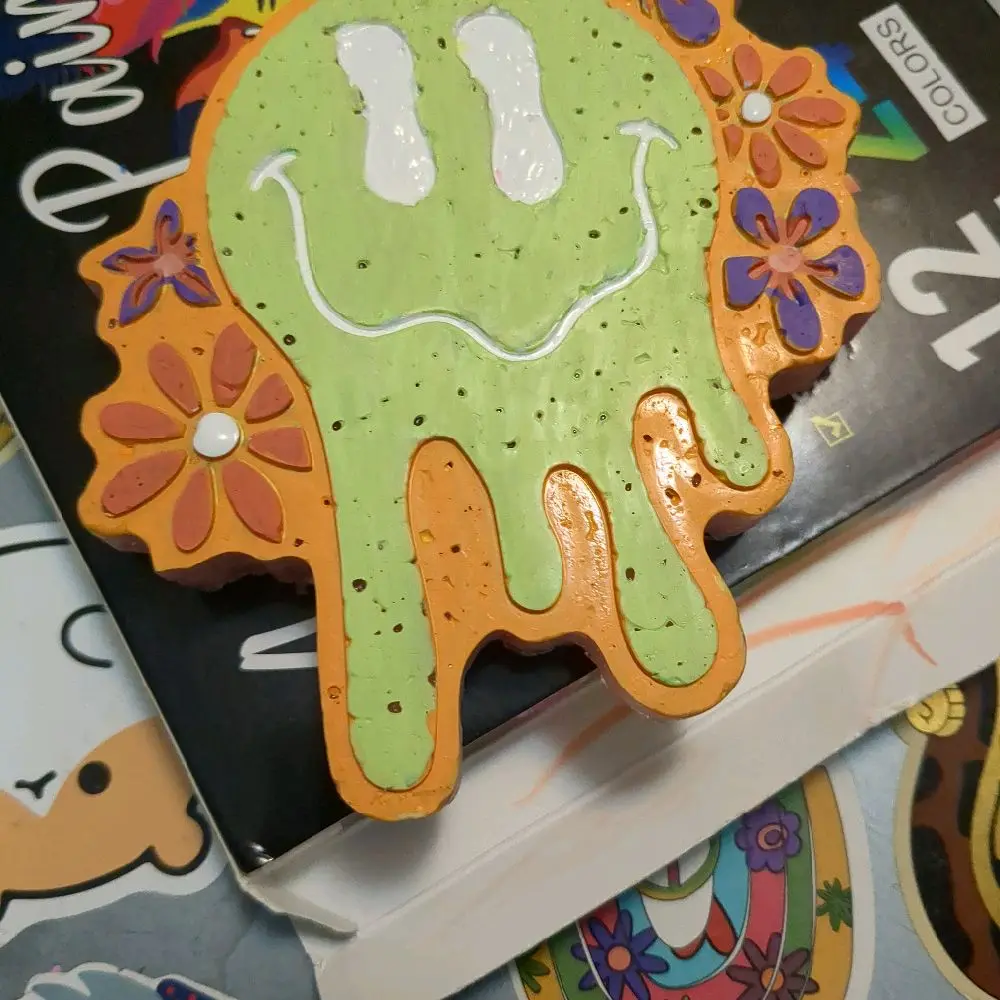 Melting Smiley Face Auto Freshie with Vibrant Colors and Floral Accents for Car Aromatherapy