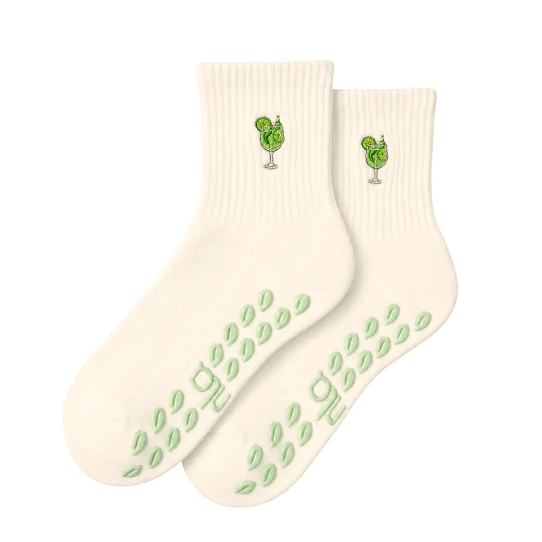 The Hugo Spritz Embroidery Grip Sock with mint leaf shaped grips for Pilates, Barre, Lagree, and Yoga