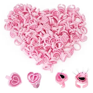 100PCS Pink Heart-Shaped Glue Rings - Disposable Plastic Lash Glue Holders, Essential Pigment Rings for Eyelash Extensions, Grafting & Tattoo, Ideal Beauty Auxiliary Tool for Professionals