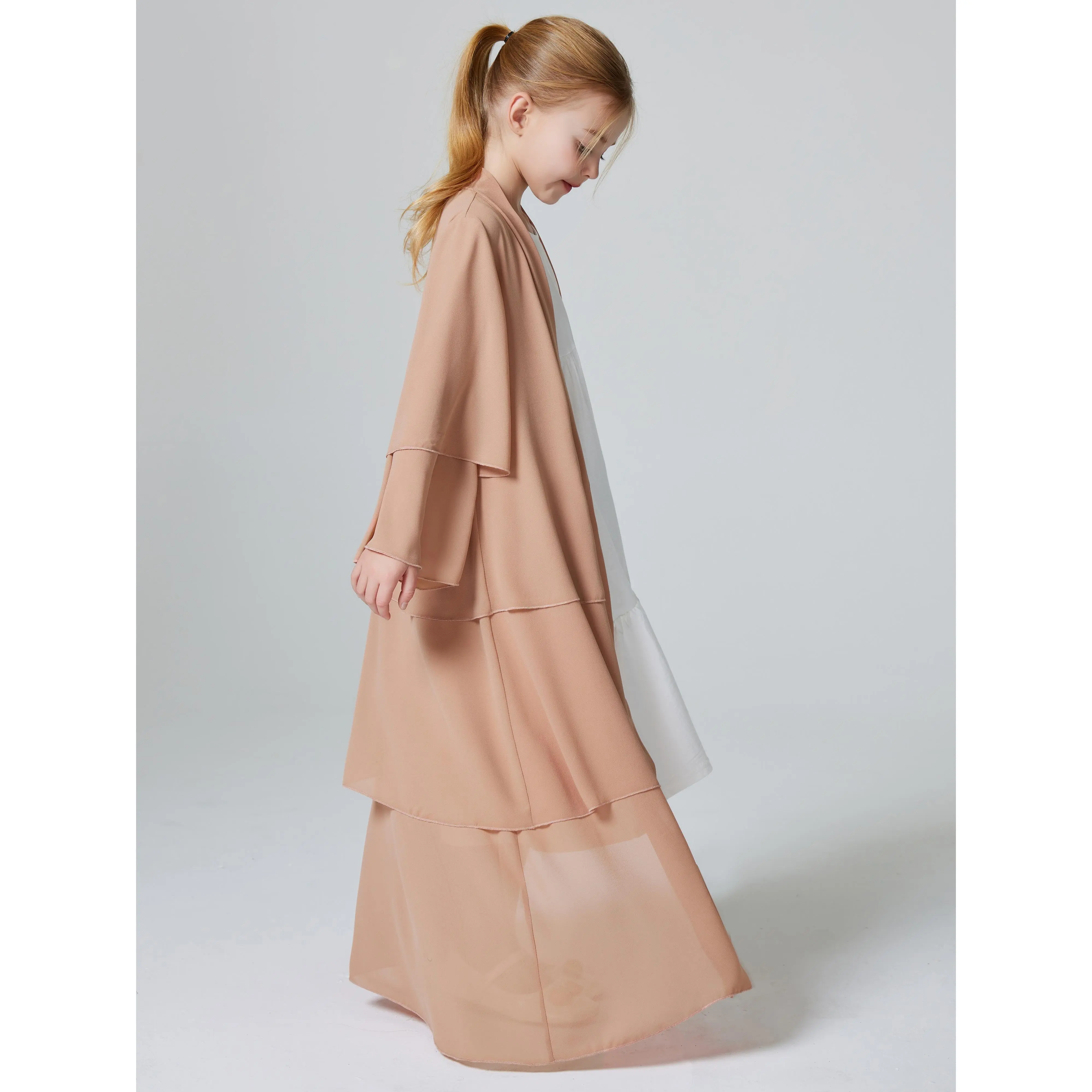A Solid Color Long Dress Abaya with a Three-Layer Chiffon Cardigan for Muslim Girls from Turkey in Dubai.