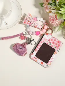 Spring Floral Card Holder & Keychain Set. The pink and white small flowers are incredibly soothing. It comes complete with a beaded bracelet, full-diamond mini bag and sparkling diamond wrist strap — an essential atmospheric accessory for sweet girls.