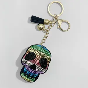 Halloween Skull Car Keychain with Rainbow Rhinestones and Gold Tassel Festive Bag Pendant Accessory for Halloween Enthusiasts