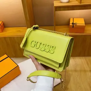 Green Crossbody Bag with Chain Strap and Embossed Logo - Perfect for Everyday Use