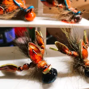 Handtied RiverCrawfish Style FlyJigs with Colorful Orange and Blue Accents and Feathers