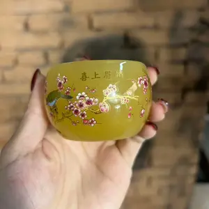Yellow-painted Night-glow Teacup with Joy Adorning the Plum Branch