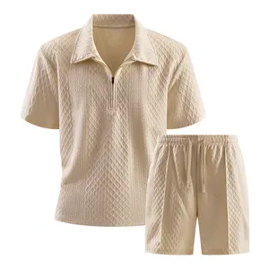 Men’s two-piece summer outfit set: textured geometric knit quarter-zip polo shirt and drawstring shorts. Casual matching resort wear for beach vacations; lounge suits in an old money style.