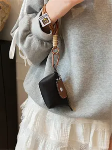 Mini women's flip button casual and compact handbag, wrist pocket, multiple colors to choose from, suitable for daily clothing matching, fashionable for going out.