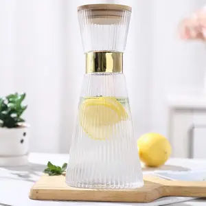 Ribbed Glass Carafe with Lid (34Oz), Elegant Water Carafe with Gold Decoration, Crystal Glass Carafe, with Thickened Bottom, for Juice, Milk, Tea, Food-Grade Silicone, Leak-Proof Eletree Bamboo Drinkware Jugs Pitcher Transparent Sturdy Pour Pitcher.