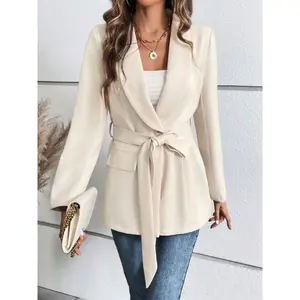 A women’s peach-colored, collarless fitted blazer with a belt, featuring a simple design and versatile appeal for casual wear.