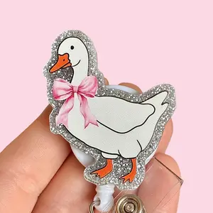 Glitter My Badge Pink bow silly coquette goose all my systems are nervous badge reel for nurse and hospital workers. Badge clip Badge pull - Retractable swivel clip with a 360 rotation. Great gift for coworker.