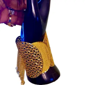 Gold Plated Bangle Bracelet with Intricate Filigree Design and Tassel Accents for Women