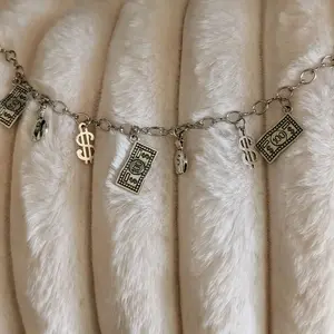 Money Bags Bracelet with Dollar Sign Charms and Coin Pouch Design