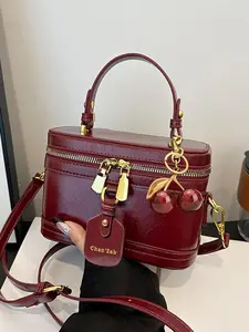 Vintage light luxury style exquisite texture flip small square box bag, elegant atmosphere, practical and versatile style, multi back single shoulder handbag with cherry pendant design, suitable for parties and dates