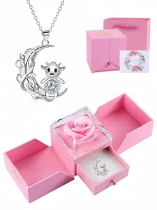 "Silver Moon Cute Cow Gem Necklace" - A unique design necklace featuring a dairy cow gemstone, packaged in a pink rose gift box. It is suitable for various gift occasions, such as Mother's Day gifts or Valentine's Day gifts.