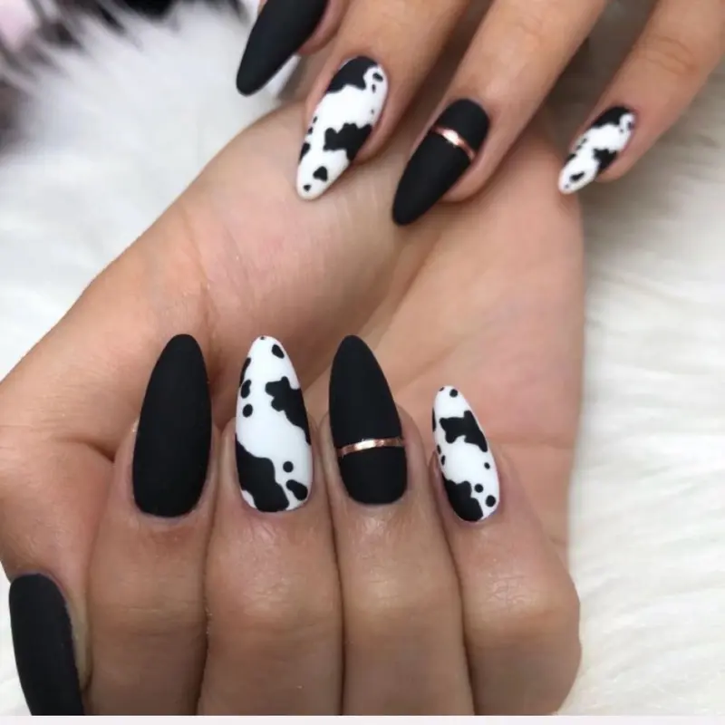 Moo & Metallic Matte Black & White Cow Print Nails with Rose Gold Accents for Stylish Look