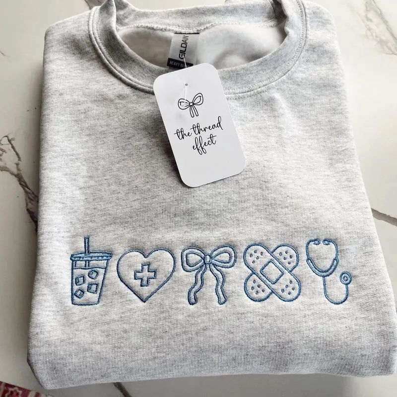 [MADE IN US] Coquette Nurse Embroidered Sweatshirt, Cute Cotton Crewneck, Cozy Womenswear Gift for CNA or Nursing Student, Soft Aesthetic Everyday Outfit