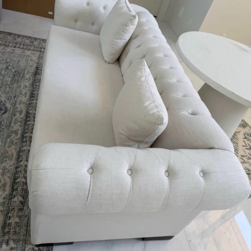 White tufted sofa