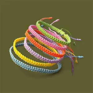 Set of 6 friendship bracelets in green, yellow, blue, purple, orange, and pastel pink.