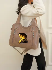 This Michael Jackson pattern handbag features a zip closure and is perfect for the back-to-school season or as a New Year's gift.