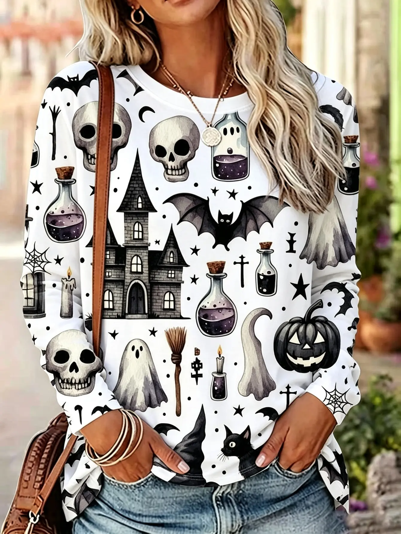 Plus-size women’s long-sleeve crew neck T-shirt with Halloween skull, witch, and ghost print; casual loose pullover top for fall fashion and everyday wear, designed for curvy ladies.