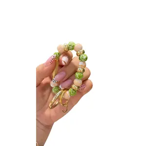 Handmade beaded keychain (Green and gold)