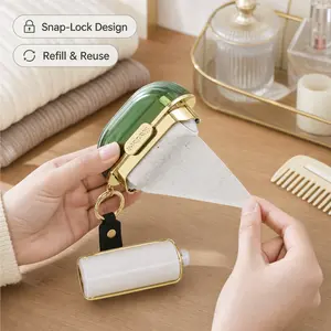 Portable Lint Roller, with keychain lanyard, compact translucent shell, replaceable adhesive sheets for removing lint and pet hair on clothes and fabric surfaces