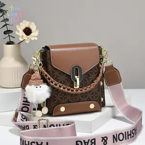 Vintage Monogram Mini Crossbody Bag | Retro Brown Leather Trim | Gold Lock & Braided Chain Detail | Wide Pink Letter Strap | Cute Plush Doll Charm Included | Compact & Stylish | Perfect for Daily Outings | Ideal Gift for Her | Durable & Fashionable | Aest