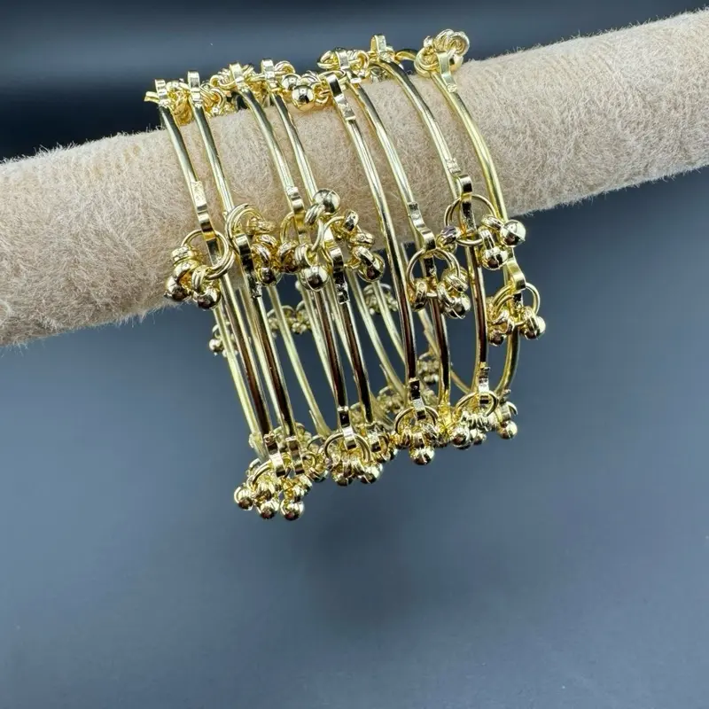 Kashmiri Ghunghru Bangles - Gold Tone 8 piece Kashmiri Ghunghru Bangles - Gold Tone 8 piece
