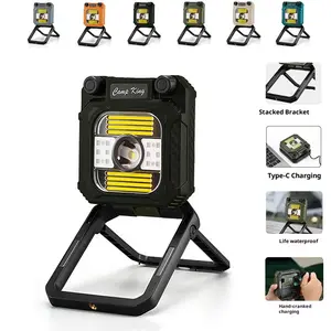 Outdoor camping light, work light, strong magnetic adsorption maintenance light, tent light, hand cranked charging light, portable emergency light with built-in bracket, warm light, white light switching, rotary infinitely dimming LED lamp
