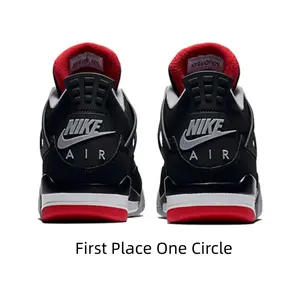 Iconic Black Mid-Top Basketball Sneakers with Red Accents and Grey Overlays for Streetwear