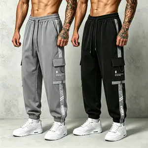 2-pack men’s color-block cargo jogger pants with an elastic drawstring waist and practical side pockets, featuring letter prints and stripe details; quick-drying and breathable—casual street-style long pants suitable for hip-hop, sports, and everyday wear
