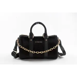 ROXY TOP HANDLE DUFFLE BAG in Luxurious Black Vegan Leather with Faux Hair Hide Accents Spacious Interior & Sturdy Handle for Comfortable Carrying