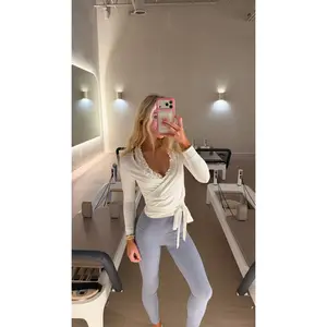 Hera Women's Long Sleeve Wrap Top in White | Yoga & Workout Shirt